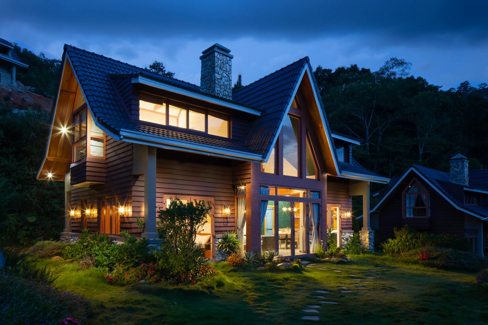Exterior of a modern residential property with landscaping, representing a short-term rental