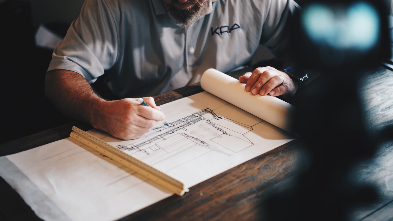 Commercial construction site with structural framing and a crew reviewing plans on the job